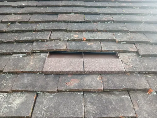 Tile roof outlet with hidden vent