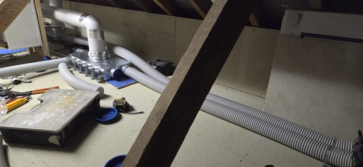 75mm twin quiet vent pipes routed through the ceiling to a bedroom outlet diffuser