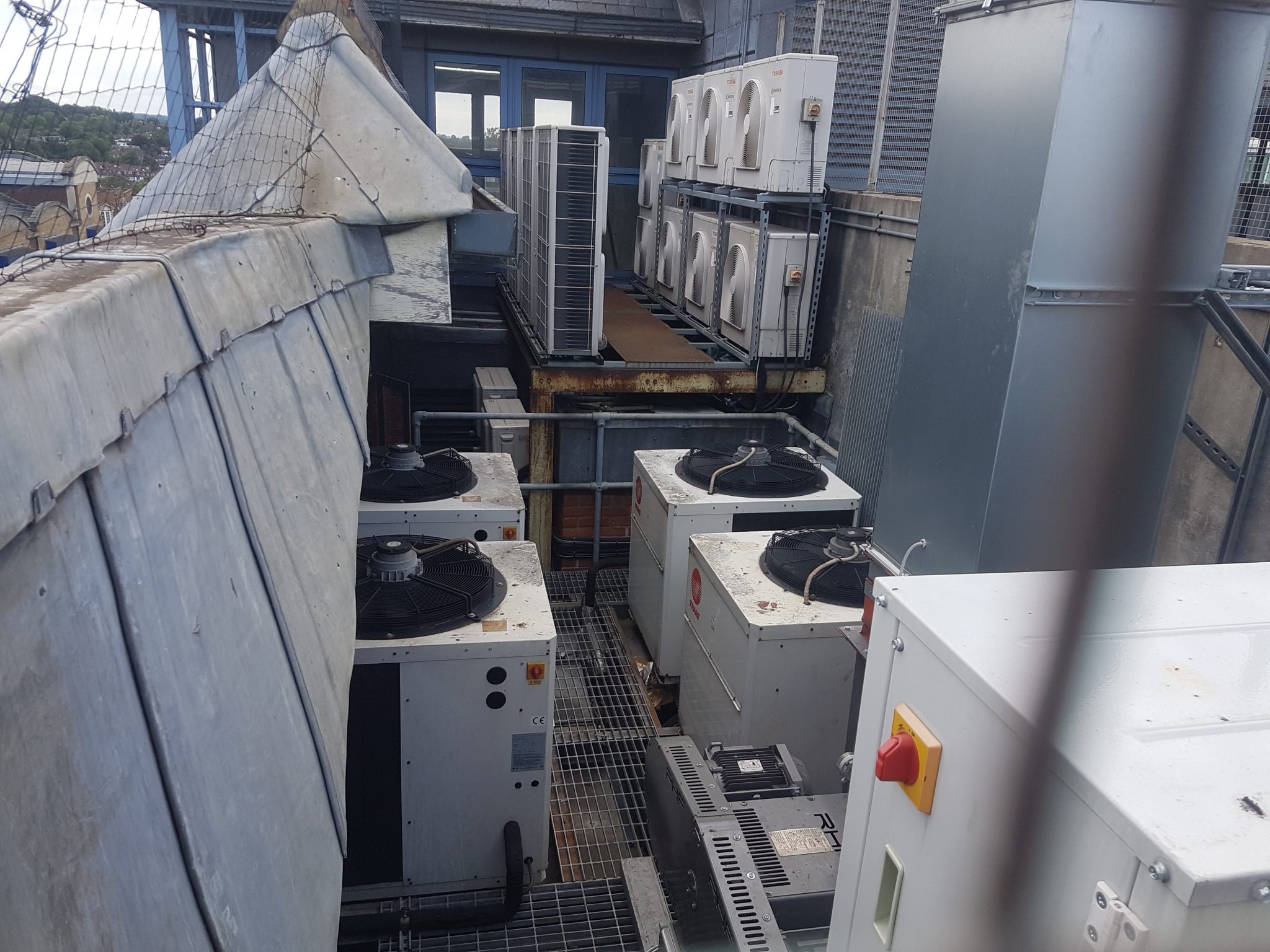 Technician performing maintenance on an HVAC system